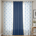 Set of three cotton curtains with two white panels featuring blue floral patterns and one solid deep blue panel in the.