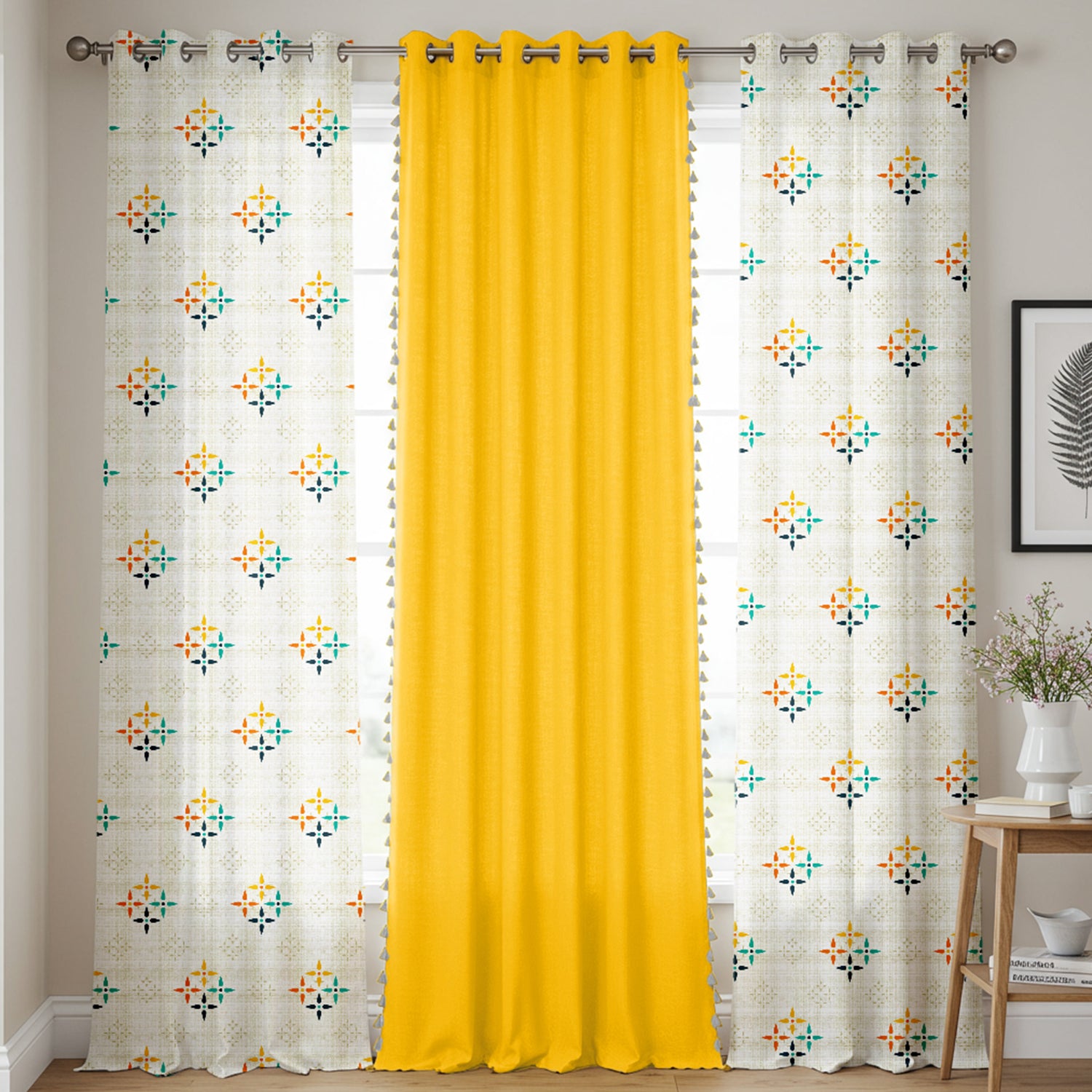 Set of three cotton curtains with two white panels featuring colorful mosaic floral prints and one solid bright yellow panel