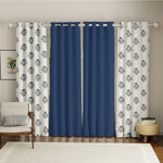 Set of four 7-foot cotton curtains with solid deep indigo panels and white panels featuring blue floral patterns.