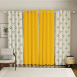 Set of four cotton curtains, two solid bright yellow and two patterned with yellow, teal, and white mosaic design,.
