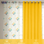 Set of three cotton curtains with one solid bright yellow panel and two white panels featuring a colorful mosaic pattern.