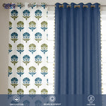 Set of four cotton curtains with floral print in blue and green on white and solid deep indigo blackout panels.
