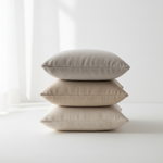 compact image with one cushion over other. nuetral color cushions